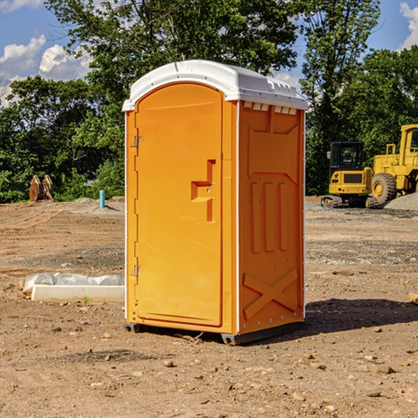 what is the cost difference between standard and deluxe portable restroom rentals in Corning